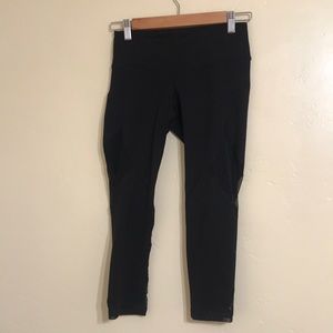 Black capris work out leggings with mesh cutouts